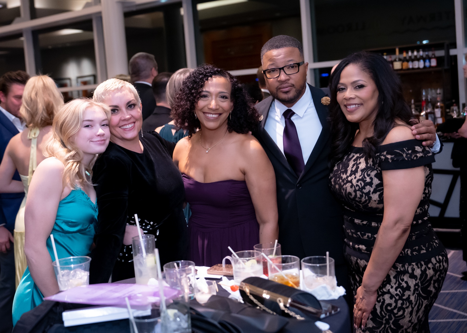 Guests gathered at a cocktail table