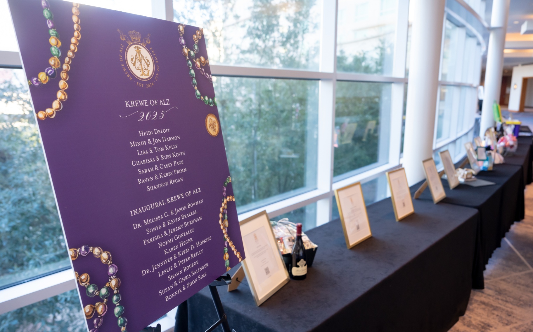 Krewe of Alz 2025 signage and silent auction