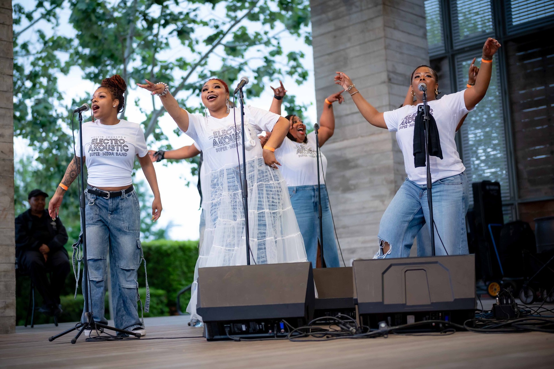 Three vocalists mid-performance
